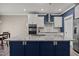 Beautiful kitchen with stainless appliances and a navy blue island at 22 Combine Trl, Benson, NC 27504