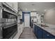 Modern kitchen design with stainless steel appliances and blue accents at 22 Combine Trl, Benson, NC 27504