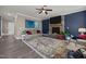 Cozy living room with a stone fireplace, large rug, and comfortable seating at 22 Combine Trl, Benson, NC 27504