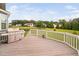 Back porch features wood decking, white railing, and a grill at 265 Beckwith Ave, Clayton, NC 27527