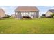 Spacious backyard features a lawn, fence, and a back porch at 265 Beckwith Ave, Clayton, NC 27527