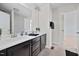 Modern bathroom with double sinks and a spacious vanity with dark cabinets at 265 Beckwith Ave, Clayton, NC 27527