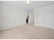 A well-lit bedroom features neutral carpet and a large closet with classic doors at 265 Beckwith Ave, Clayton, NC 27527