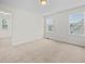 Bright bedroom with a neutral palette with ample natural light from two large windows at 265 Beckwith Ave, Clayton, NC 27527
