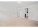 The bedroom boasts an open entryway, and neutral walls at 265 Beckwith Ave, Clayton, NC 27527