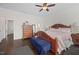 Comfortable bedroom featuring a wooden bed frame, ceiling fan and dresser at 265 Beckwith Ave, Clayton, NC 27527