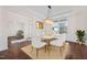 Bright dining room features modern chandelier, white table and chairs, and view to front yard at 265 Beckwith Ave, Clayton, NC 27527