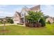 Well-maintained home featuring a two-car garage, brick facade, and landscaped front yard at 265 Beckwith Ave, Clayton, NC 27527