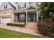 Inviting front porch with seating, decorative plants, and a welcoming entrance at 265 Beckwith Ave, Clayton, NC 27527