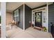 Cozy front porch with outdoor seating and charming seasonal decorations at 265 Beckwith Ave, Clayton, NC 27527