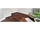 Bright home office features dark hardwood floors, elegant chair, and lush green plant at 265 Beckwith Ave, Clayton, NC 27527