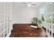 Sunlit office with French doors features a comfortable chair and lush potted plant at 265 Beckwith Ave, Clayton, NC 27527