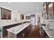 Open kitchen showcasing granite countertops, stainless steel appliances, and a kitchen island at 265 Beckwith Ave, Clayton, NC 27527