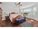 Sunlit bedroom with hardwood floors, a ceiling fan, and a dedicated desk area at 265 Beckwith Ave, Clayton, NC 27527