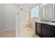 Elegant shower featuring tiled walls, a built-in bench and handicap-assist bar at 265 Beckwith Ave, Clayton, NC 27527