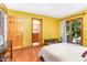 Bedroom with sliding glass doors, hardwood floors, desk and adjoining bathroom at 28 Benchmark, Pittsboro, NC 27312