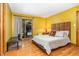 Bedroom with a queen size bed, sliding glass doors, hardwood floors, and outdoor deck at 28 Benchmark, Pittsboro, NC 27312