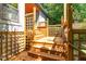 A wood deck with lattice offers access to the home at 28 Benchmark, Pittsboro, NC 27312