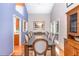 Elegant dining room with a large table, natural light, and stylish furnishings, perfect for entertaining guests at 28 Benchmark, Pittsboro, NC 27312