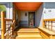 Inviting front porch with a cozy bench, offering a warm welcome to the home at 28 Benchmark, Pittsboro, NC 27312
