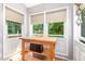 Kitchen nook with natural light, wood floors, and adjacent to the kitchen's granite counters at 28 Benchmark, Pittsboro, NC 27312