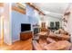 Bright living room featuring vaulted ceilings, skylights and a cozy fireplace for an inviting space at 28 Benchmark, Pittsboro, NC 27312