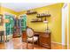 Bright home office featuring hardwood floors, a wooden desk, floating shelves and natural light from the window at 28 Benchmark, Pittsboro, NC 27312