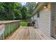 Inviting wooden deck, perfect for enjoying the outdoors, with scenic views of the backyard at 308 E Gilbreath St, Graham, NC 27253