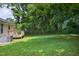 Well maintained backyard with a small deck at 308 E Gilbreath St, Graham, NC 27253