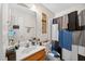Functional bathroom with a sink, toilet, and shower with a modern gray curtain at 308 E Gilbreath St, Graham, NC 27253