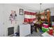 Bright dining room with table, and decor with checkered curtains at 308 E Gilbreath St, Graham, NC 27253