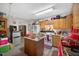 Charming kitchen with wood cabinets, a functional island, and modern appliances at 308 E Gilbreath St, Graham, NC 27253