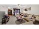 Spacious living room with a ceiling fan and view of the kitchen at 308 E Gilbreath St, Graham, NC 27253