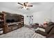 Spacious living room with large TV, cozy reclining sofa, and easy access to dining area at 308 E Gilbreath St, Graham, NC 27253