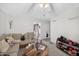 Comfortable living room with ample seating and a view to the kitchen at 308 E Gilbreath St, Graham, NC 27253