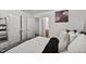 Spacious main bedroom featuring a plush bed, ample closet space, and serene decor at 308 E Gilbreath St, Graham, NC 27253