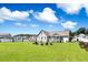 Lush backyard with a fire pit area at 308 Nashville Dr, Archer Lodge, NC 27527