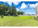 Spacious backyard featuring a playset and a fire pit with seating at 308 Nashville Dr, Archer Lodge, NC 27527