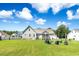 Expansive backyard featuring a fire pit area and screened-in porch at 308 Nashville Dr, Archer Lodge, NC 27527