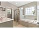 Bright bathroom with tub, shower, and double vanity sink at 308 Nashville Dr, Archer Lodge, NC 27527