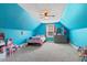 Bright blue bedroom with a pitched ceiling, ceiling fan, and carpet flooring at 308 Nashville Dr, Archer Lodge, NC 27527