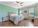 Bedroom featuring two windows, hardwood flooring, and neutral wall color at 308 Nashville Dr, Archer Lodge, NC 27527