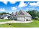 Beautiful home showcases a two-car garage and well-maintained lawn at 308 Nashville Dr, Archer Lodge, NC 27527