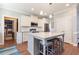 Bright kitchen featuring stainless appliances, granite counters, island and hardwood floors at 308 Nashville Dr, Archer Lodge, NC 27527