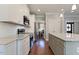 Bright kitchen featuring stainless appliances, granite counters, island and hardwood floors at 308 Nashville Dr, Archer Lodge, NC 27527