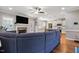 Cozy living room features a fireplace and open layout to the kitchen at 308 Nashville Dr, Archer Lodge, NC 27527