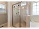 Modern shower with glass doors, dual shower heads, and built-in bench seating at 308 Nashville Dr, Archer Lodge, NC 27527