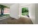 Enclosed back porch with white siding and brick accents offers a view of the lush backyard at 313 13Th St, Butner, NC 27509