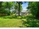 A spacious and well maintained backyard with mature trees surrounds this charming single story home at 313 13Th St, Butner, NC 27509