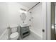 Charming bathroom featuring a stylish vanity, toilet and tiled shower over tub at 313 13Th St, Butner, NC 27509